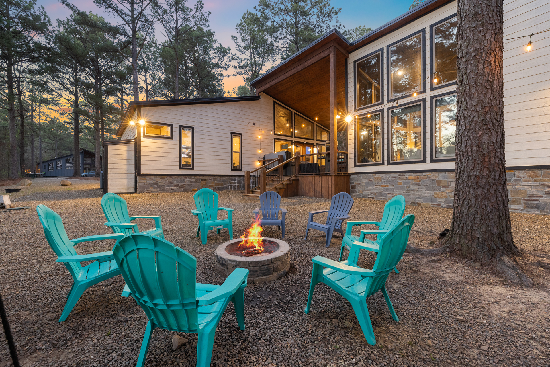 Settle into a swing, feel the fire warm your toes, and watch the sky melt into sunset as the string lights glow above you. Perfect for s’mores, long conversations, and real connection with your group.