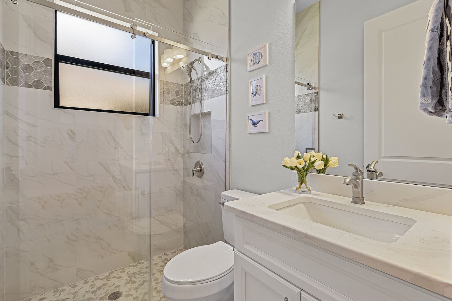 Bright and airy 4th guest bathroom featuring a stylish vanity and shower—your sanctuary for relaxation!
