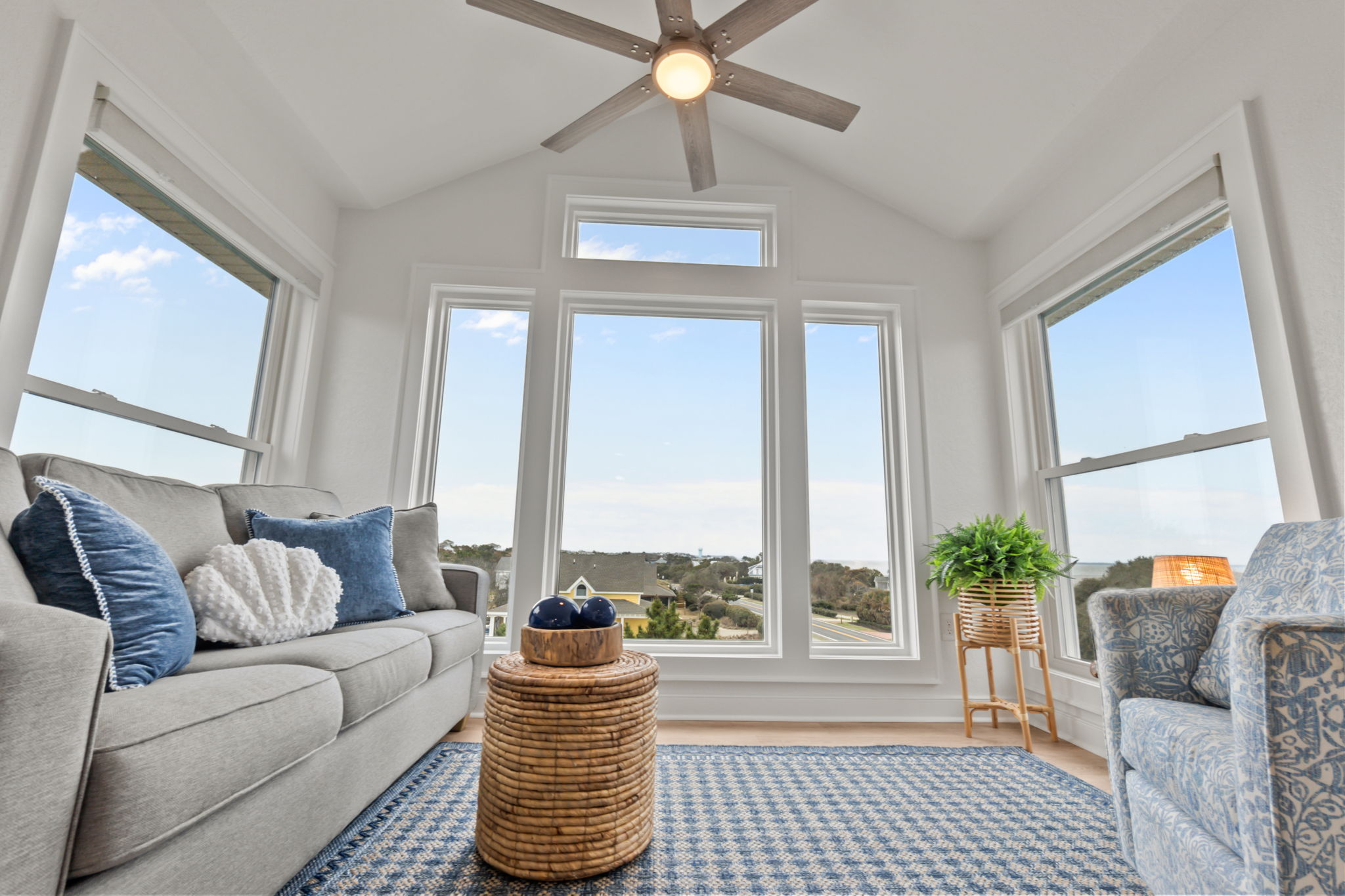 Cozy sitting area with large windows letting in tons of natural light and great views outside.