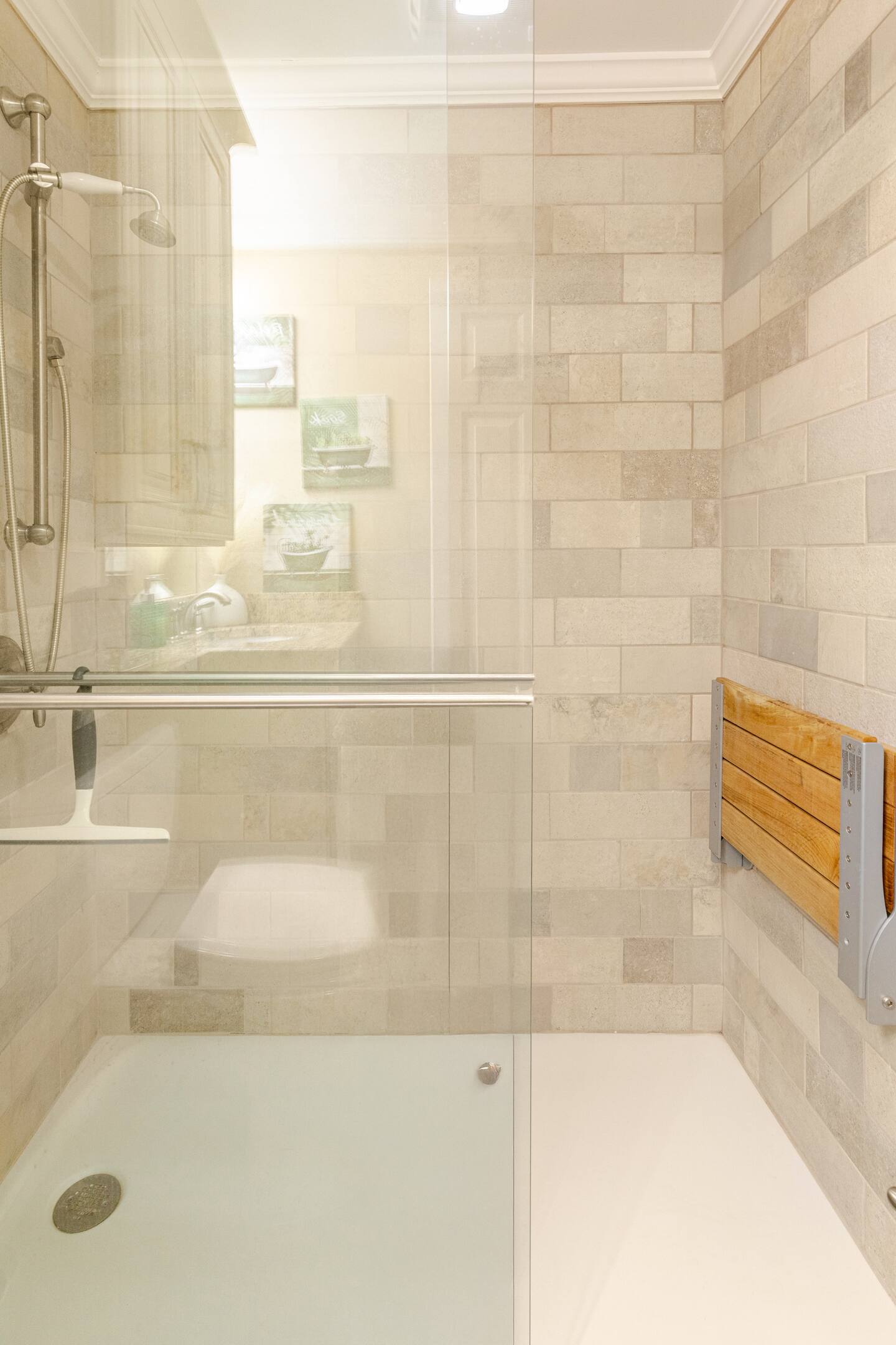 The master bathroom features glass sliding doors.