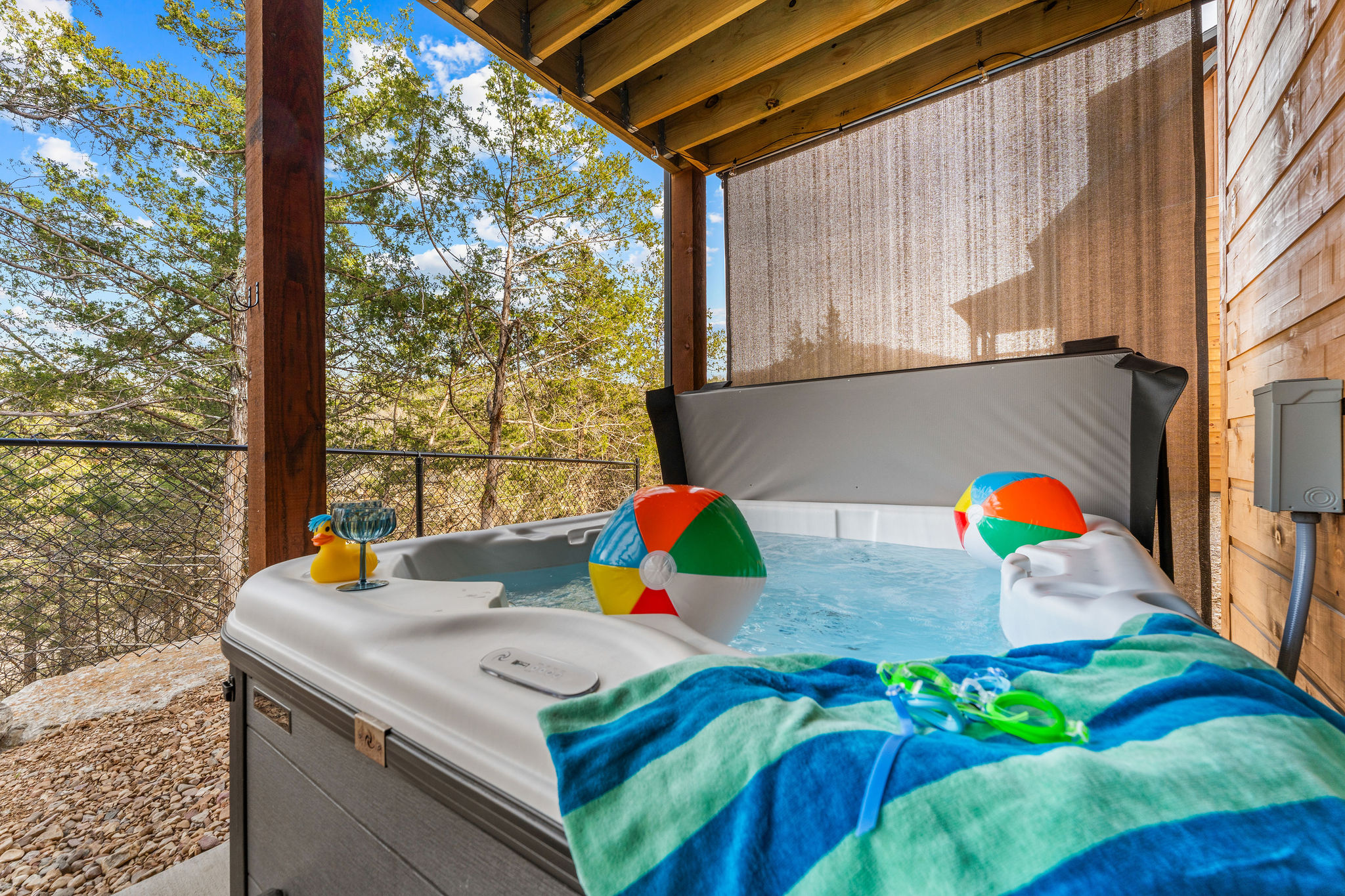 So much fun to soak in your private hot tub surrounded by trees out back.
