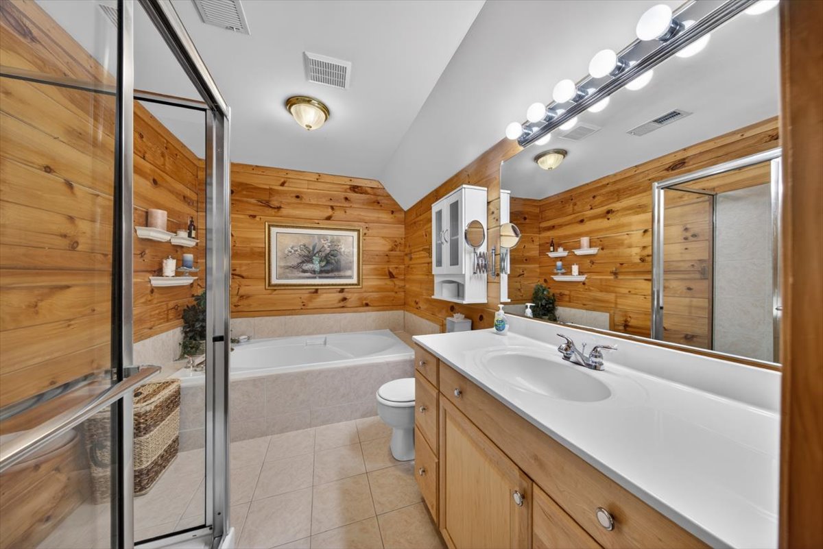 Private ensuite bathroom connected to the king suite.