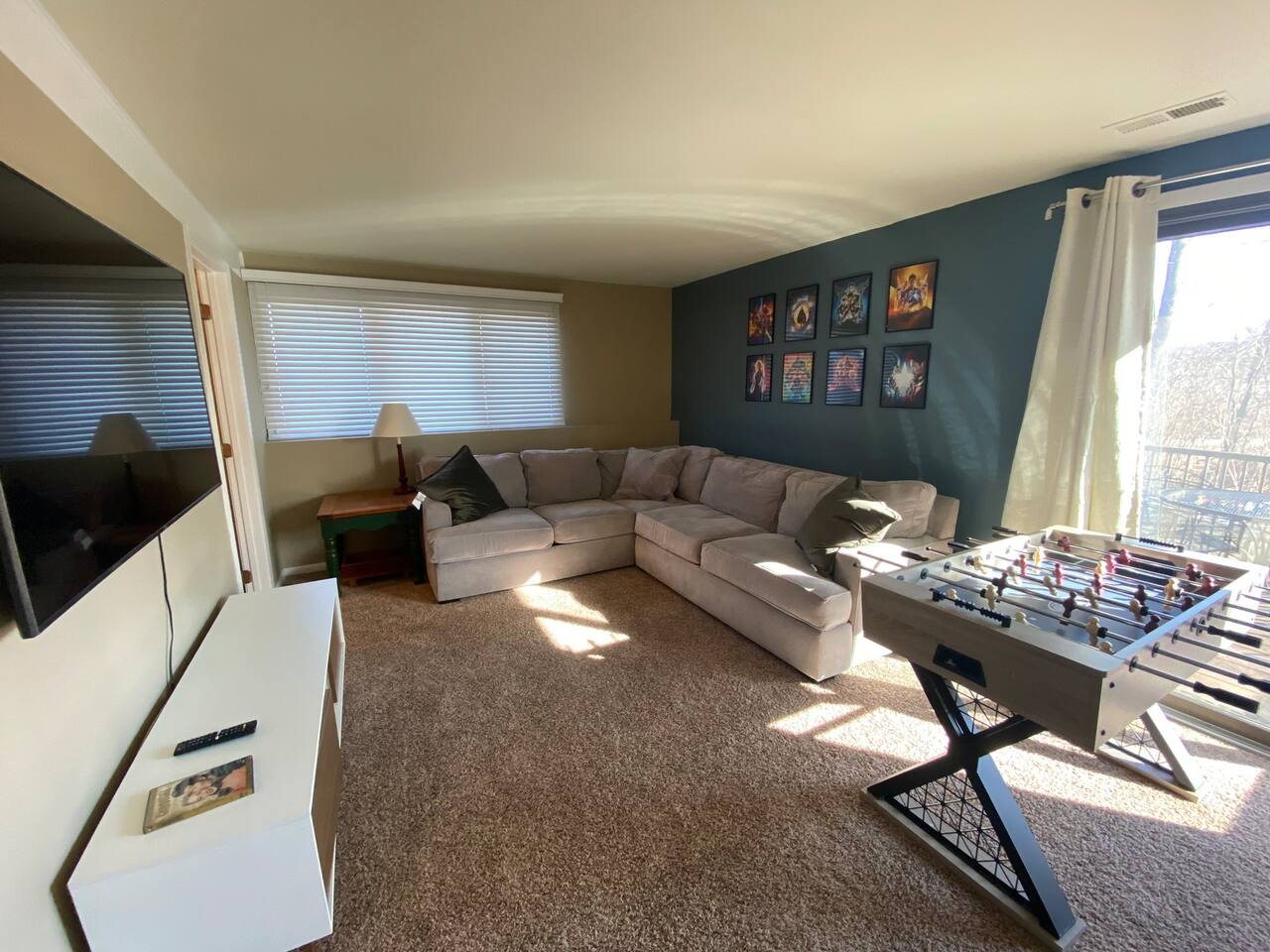 Game room. Foosball w/ 60” smart tv. Cabinet full of board games. Books. And arcade games (Pac-Man and The Simpson 4-player)