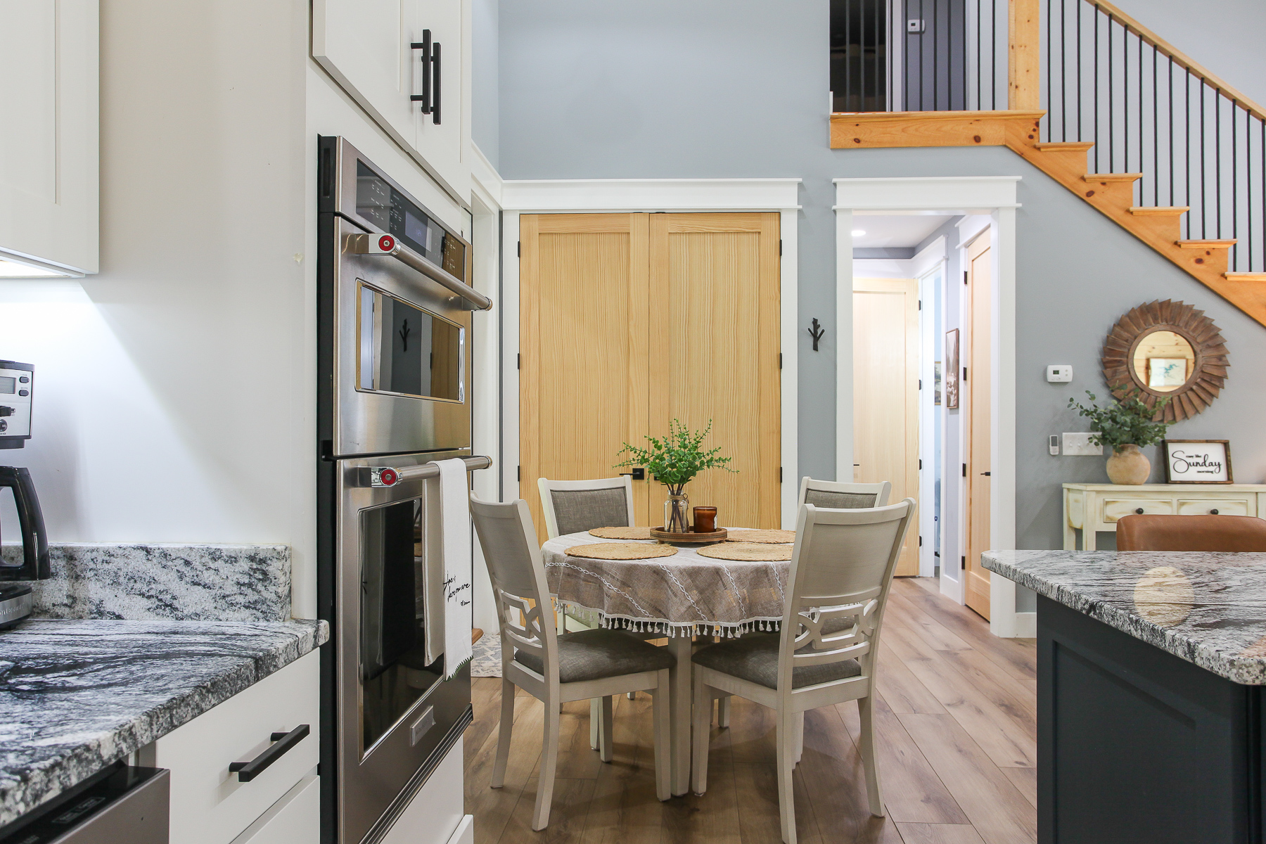 Gather for breakfast or dinner at the dining table for four, conveniently beside the kitchen at Robbin’s Nest on Snowbird Creek.