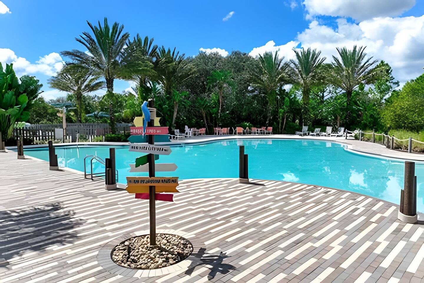 Resort-Style Pool: Dive into paradise, surrounded by palm trees.