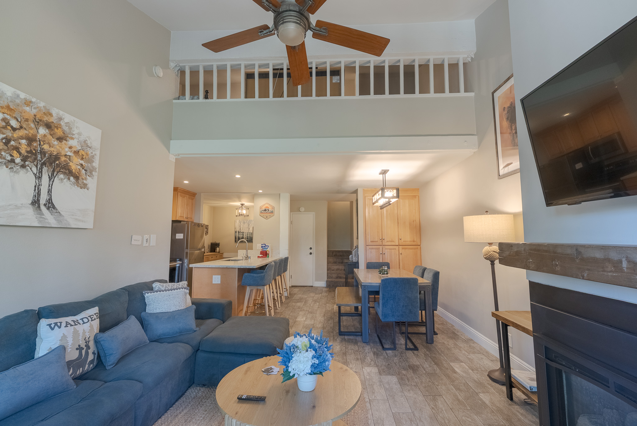 The guardrails on the second floor are connected to the kids' loft area.