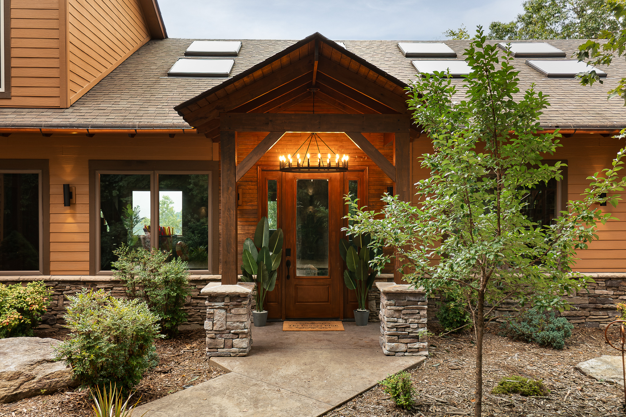 {Front Entry} Welcome to Canopy Club—your private mountain retreat tucked into the forest with lodge-style timber details from the moment you arrive.