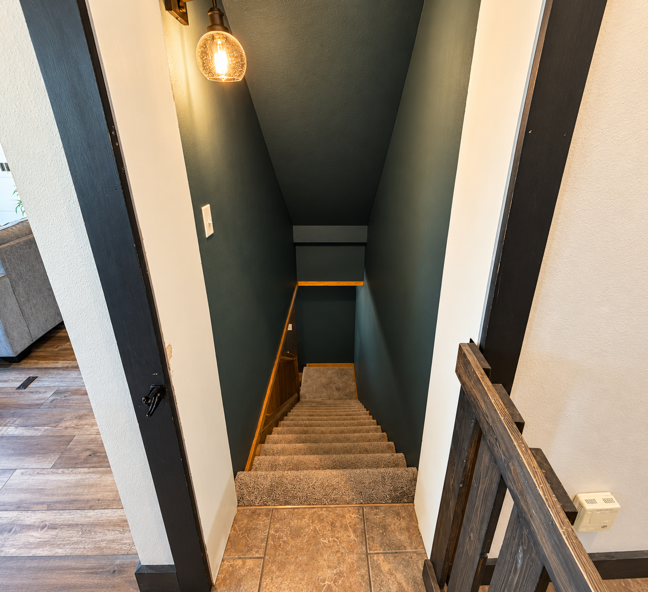 Head downstairs to the basement level, featuring an additional bedroom, full bathroom, comfortable living area, and foosball table—great extra space for families and groups to spread out.