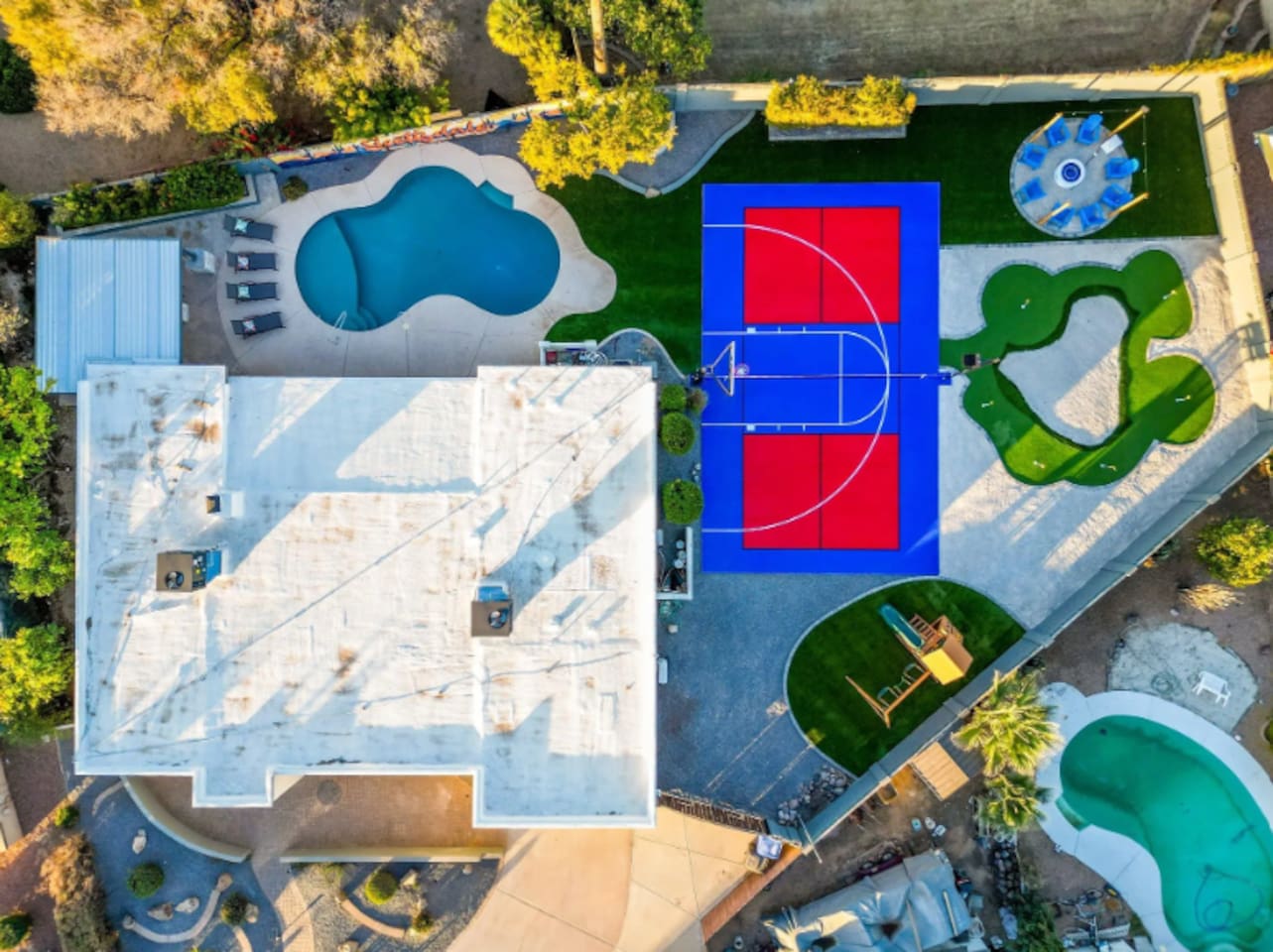 Pool on one side, sport court on the other, putting green in between — this layout was made for a group that wants options.