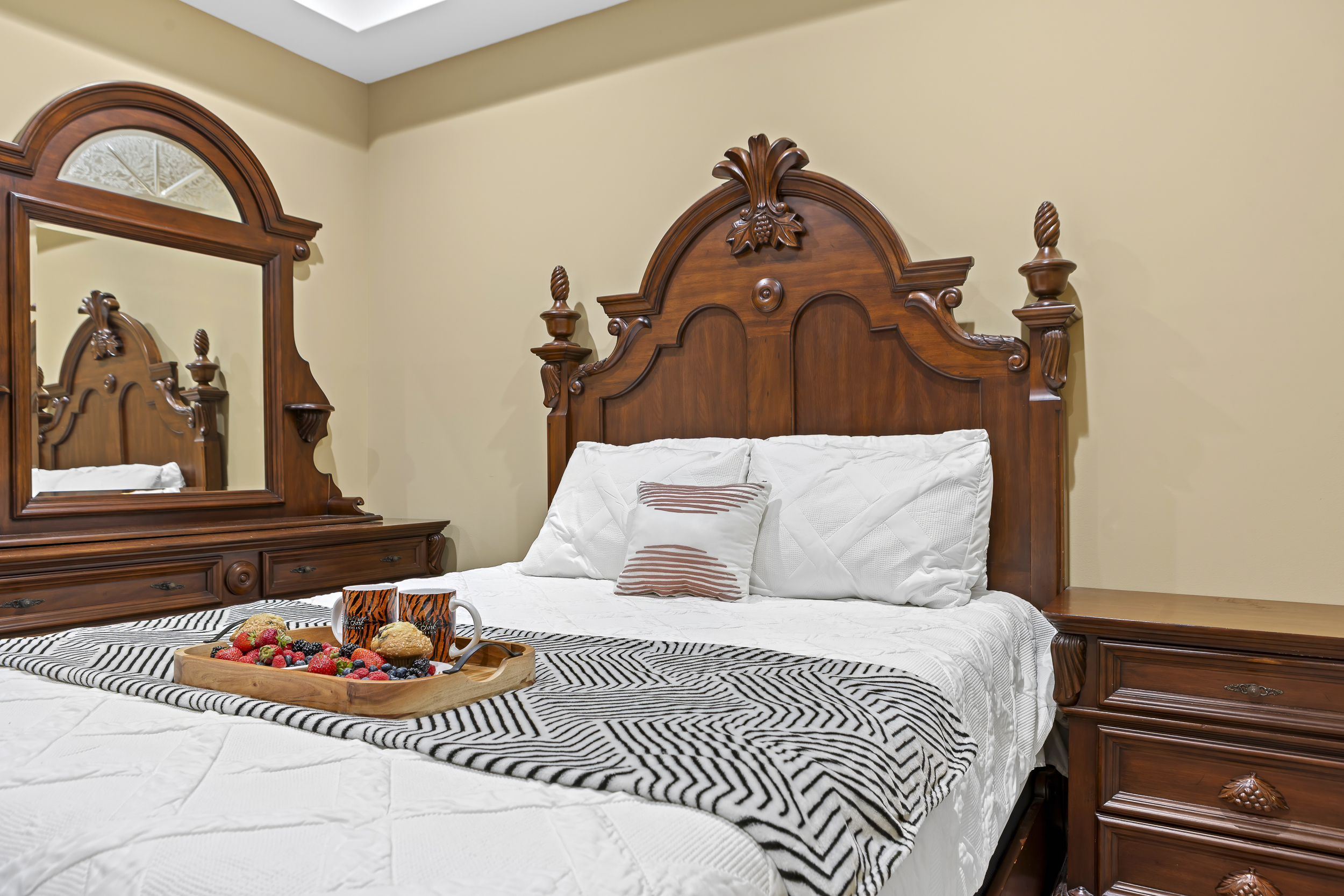 Elegant Retreat: Experience refined comfort with rich wooden furnishings and a delightful breakfast tray!
