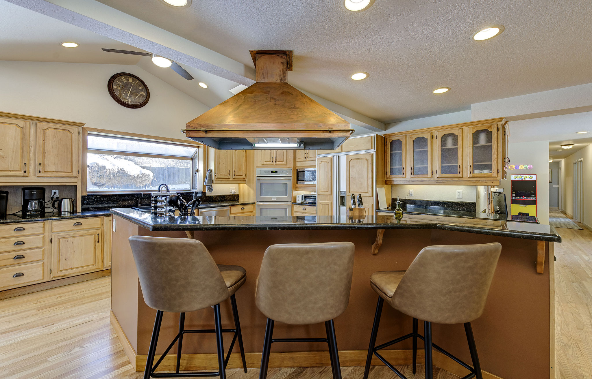 The giant kitchen is perfect for any gathering. Whether you choose to cook or order in, the kitchen is the center hub of this house.