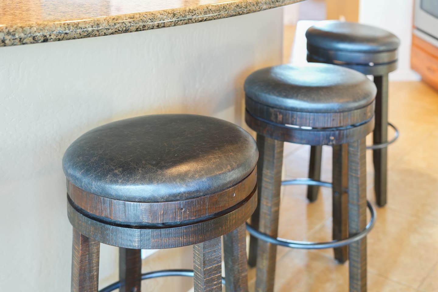 Comfortable bar seating at the kitchen island for casual meals.