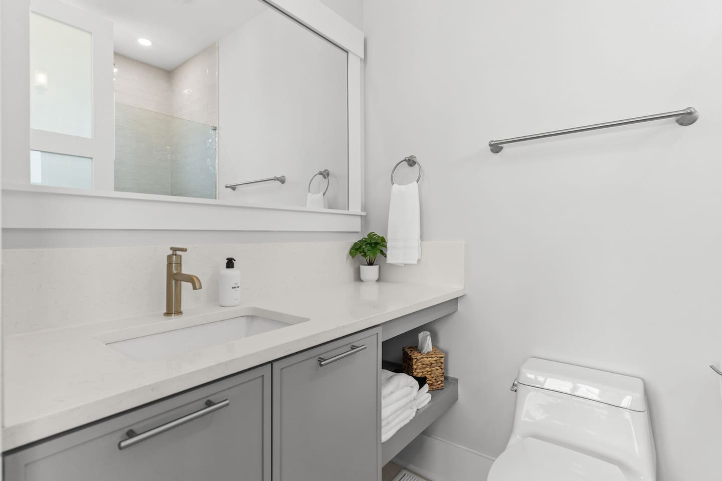 Thoughtful touches make every stay easier. This private en-suite bathroom comes stocked with essentials like hand soap, makeup cloths, tissues, and more.