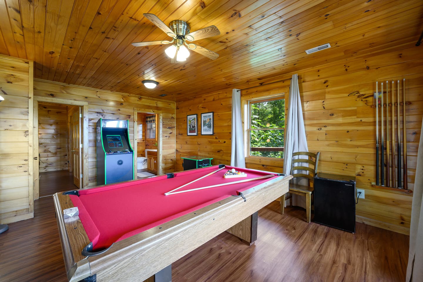 The game room has plenty of room for your family and friends to enjoy time together, as well as access to the lower level of the wrap around deck. The lower bathroom has shared access.