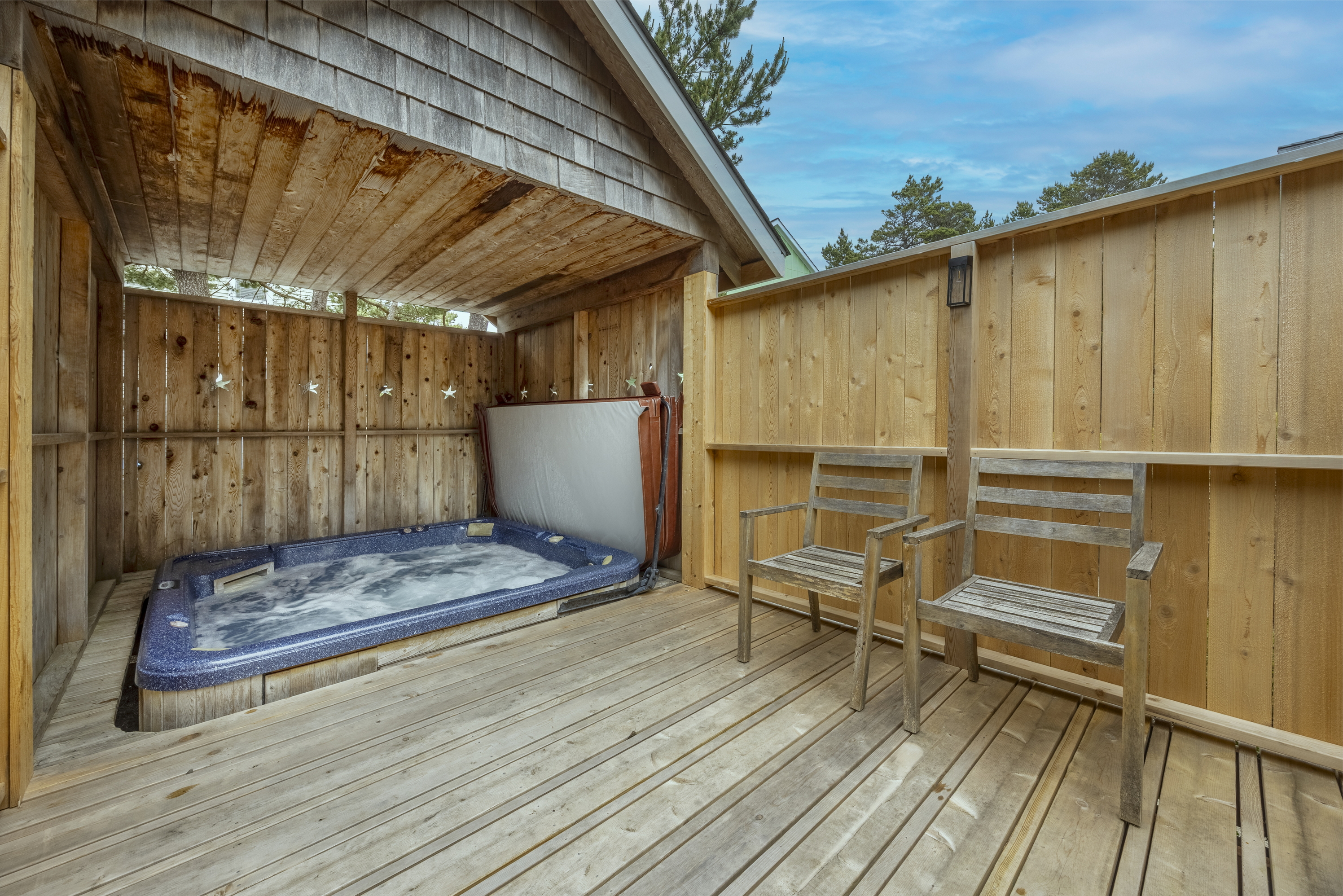 Enjoy a large hot tub that comfortably fits 6–8 guests ~ perfect for relaxing after a day at the beach!