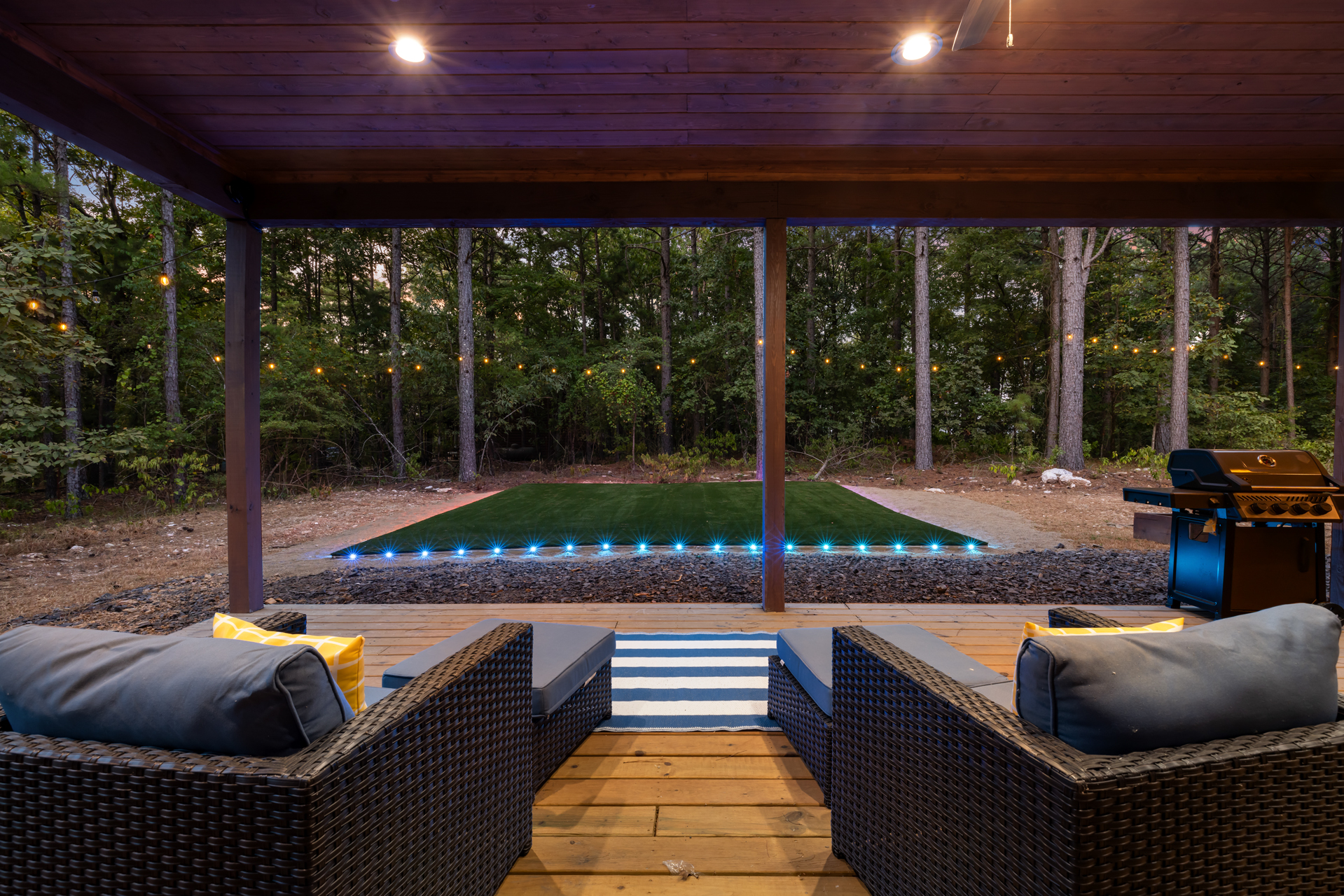 Turf Club 🌲🏈✨
Just steps from the pool and level with The Gathering Deck, this spacious turf area was designed for football tosses, soccer games, gymnastics, dance practice, yoga, and unforgettable evenings beneath the pines.