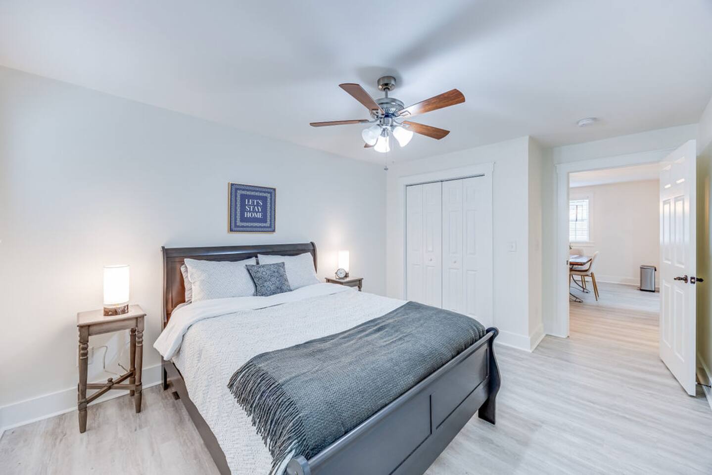 Inviting queen-sized bed, offering the perfect blend of comfort and style for a restful night's sleep.