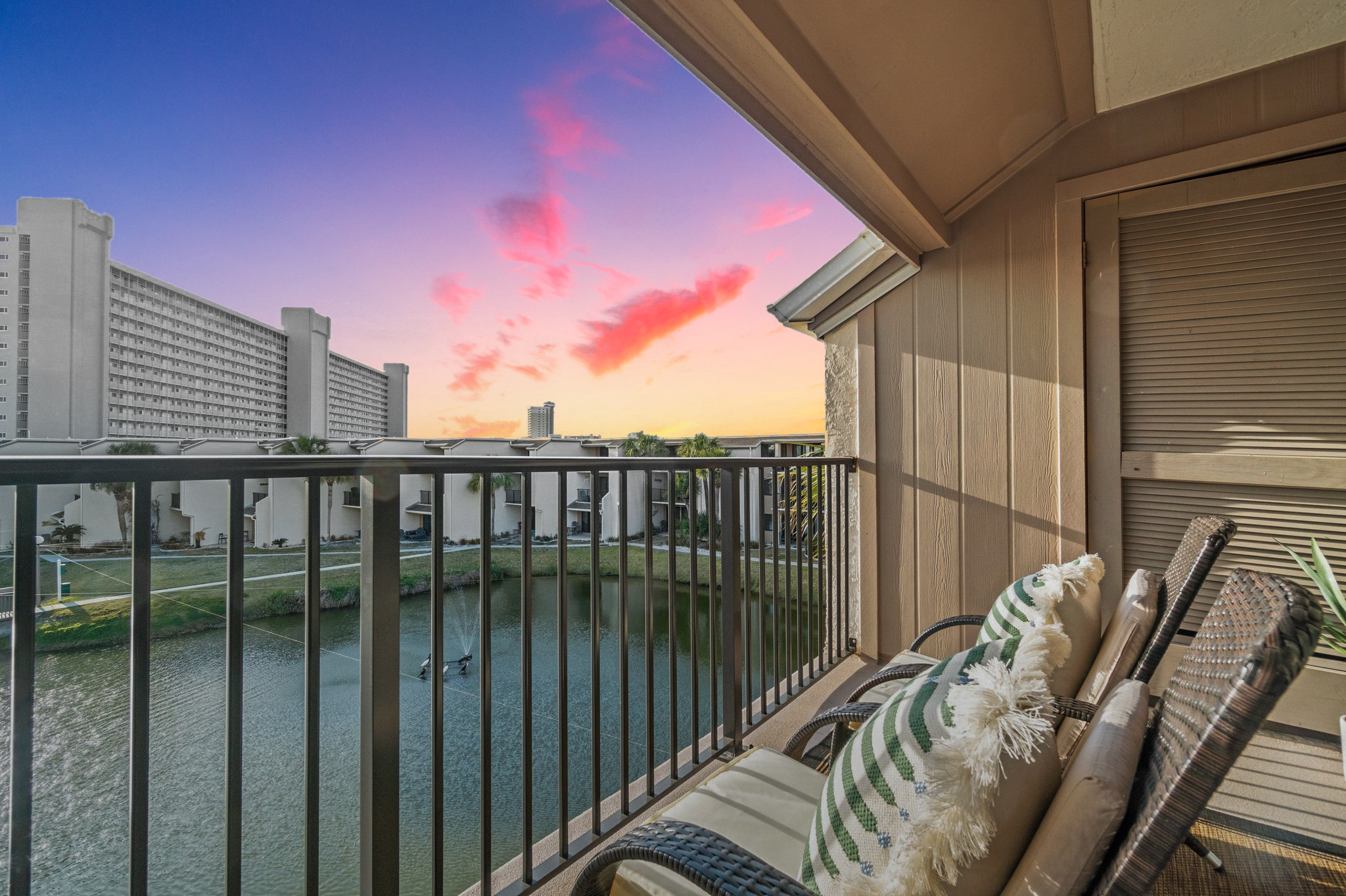 enjoy glass of wine enjoying a sunset on private balcony