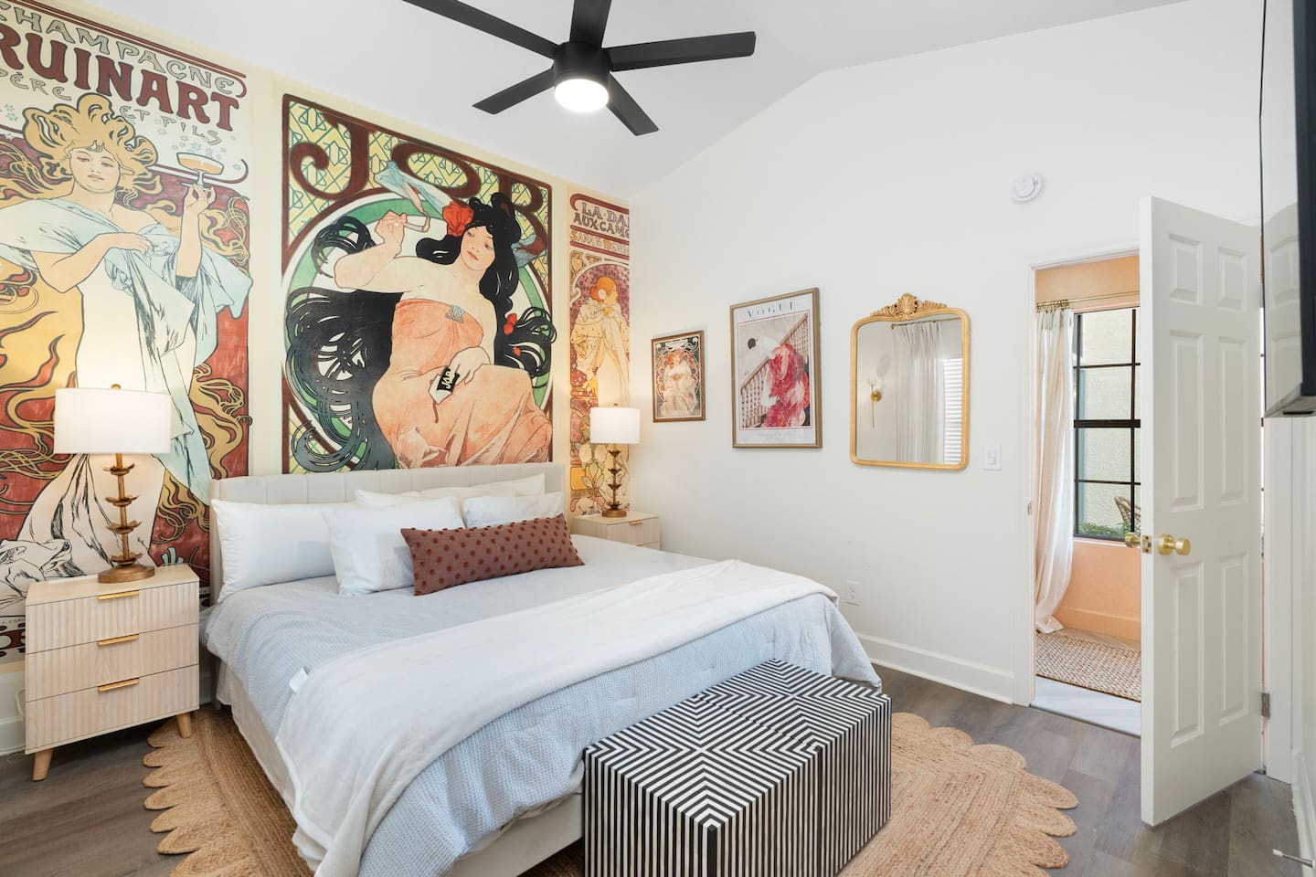 Custom artwork set the cozy tone for this king bedroom.