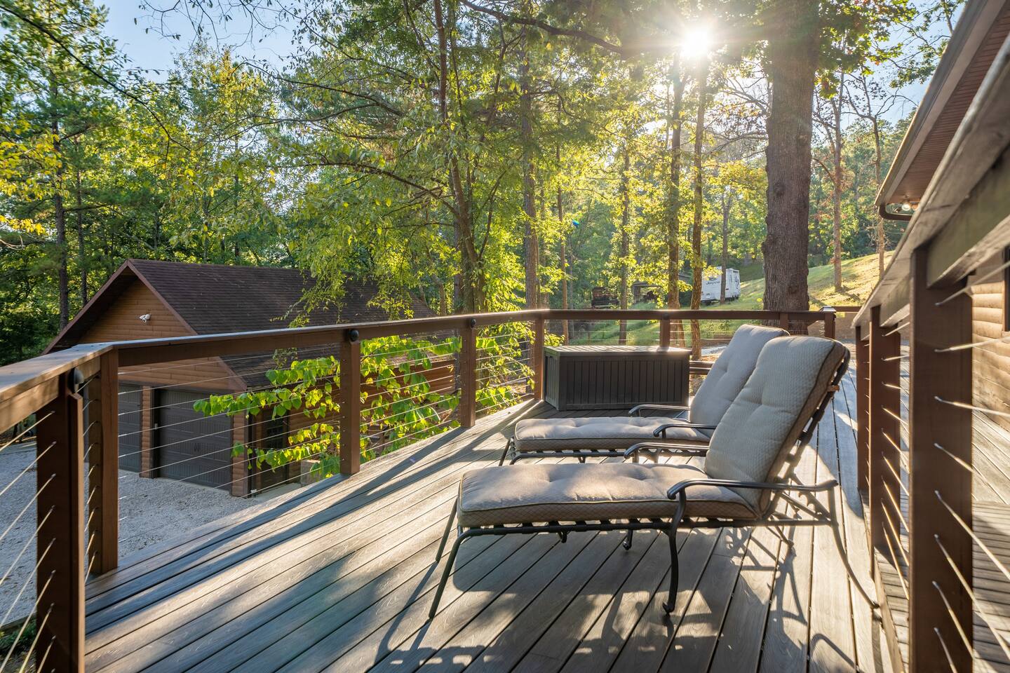 Chaise loungers overlooking the Lake. You are high up.   It is a great place to chill. -Front Deck