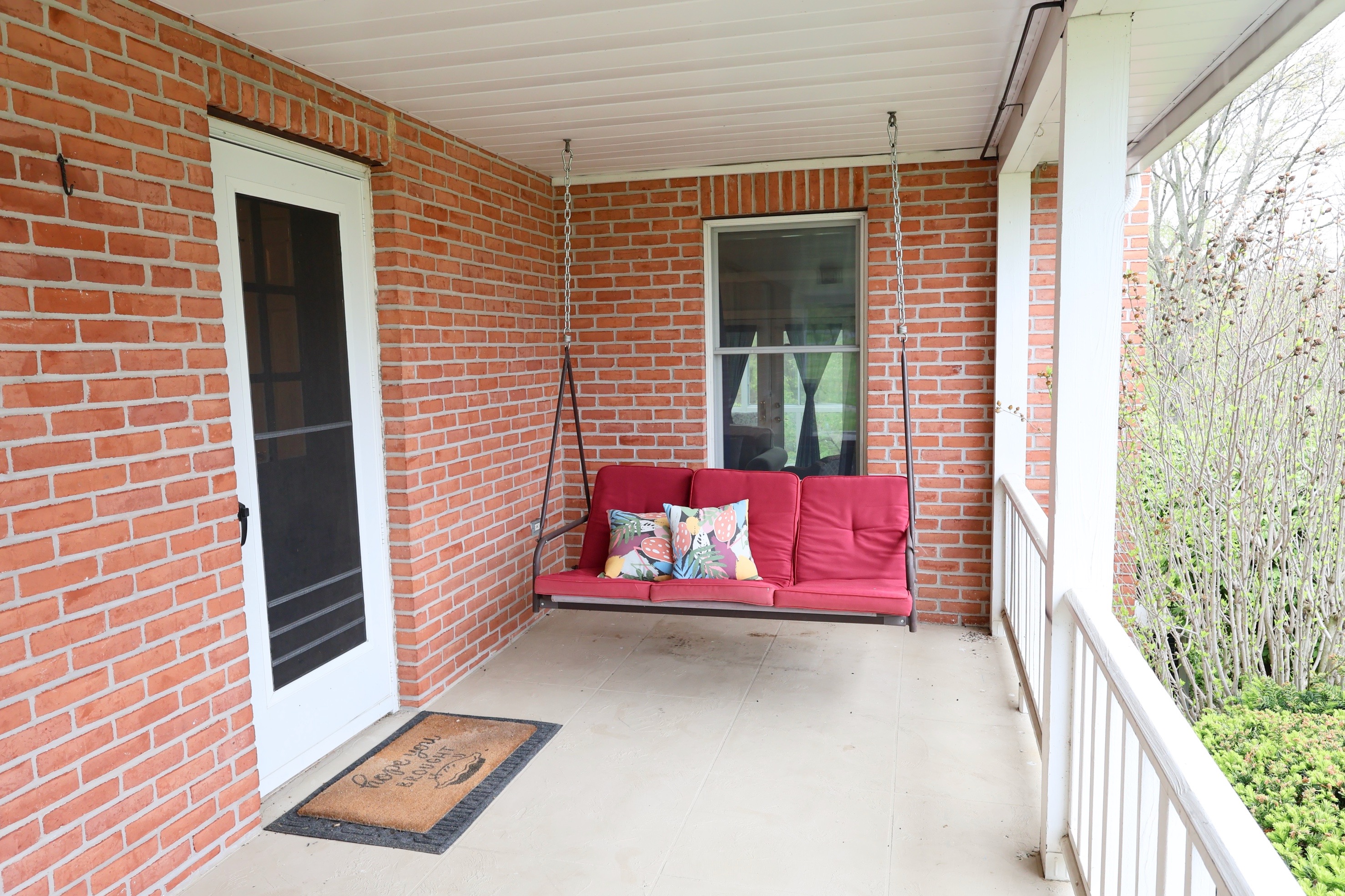 Our front porch includes a swing - take in all seasons while gently swinging