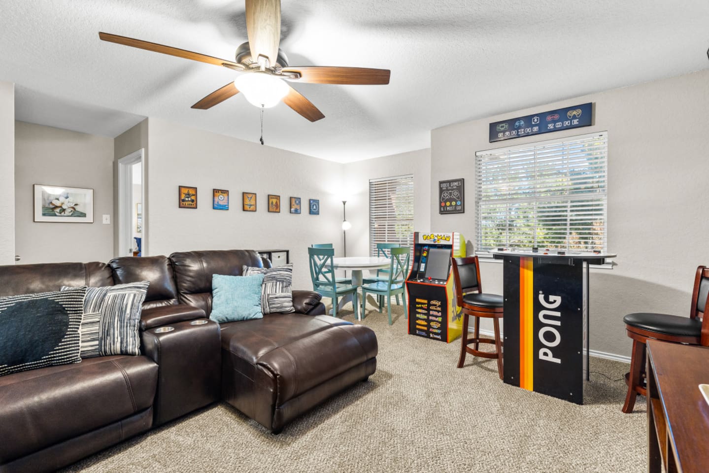 Private cinema and game room featuring a large-screen HD display and classic Pac-Man arcade, perfect for relaxing and having fun with the group.