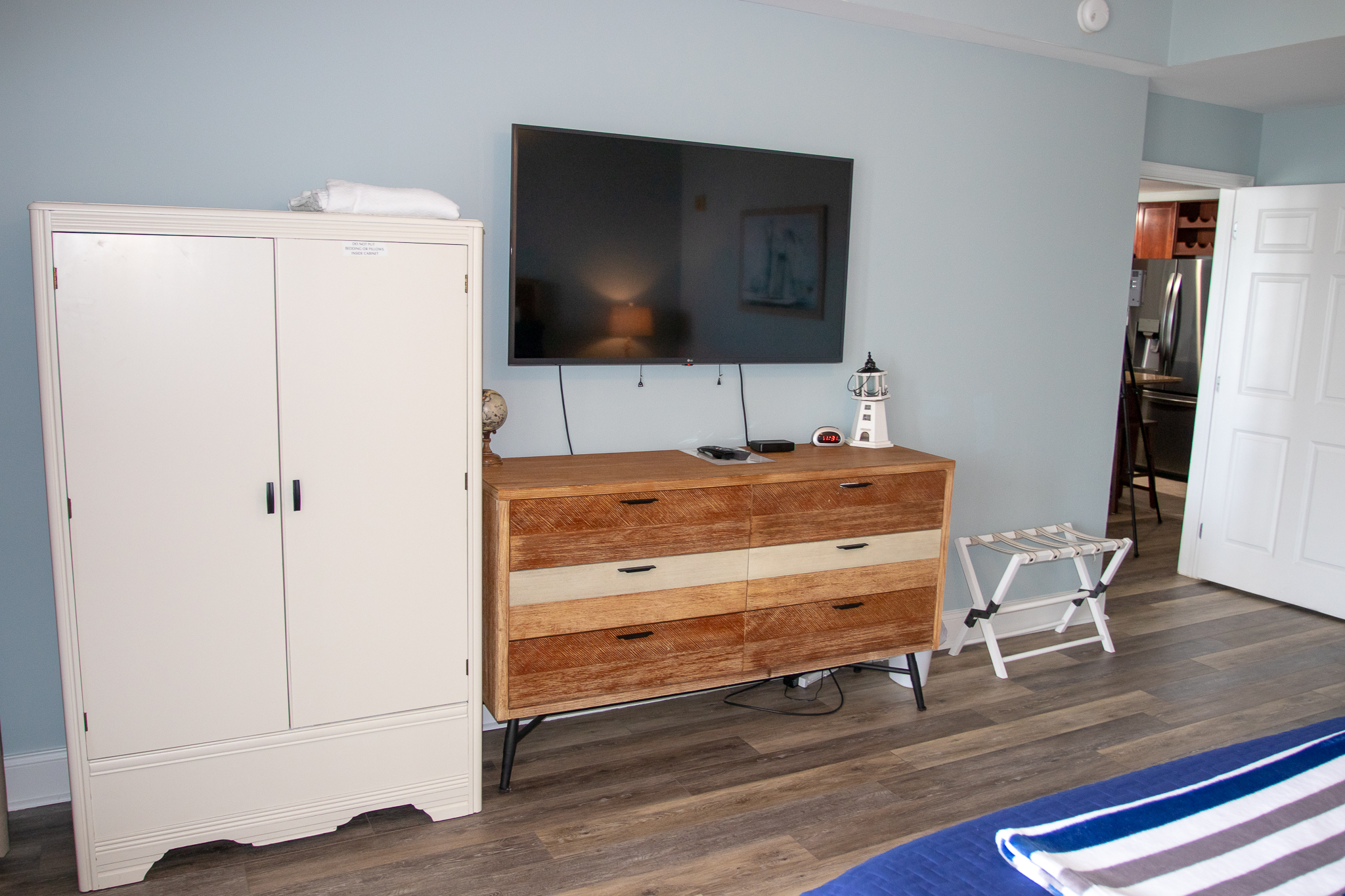 tv, dresser, and closet area in the premier bedroo