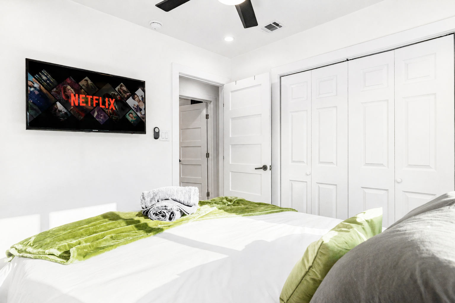 Sink into a plush bed with Netflix at your fingertips and stylish decor!