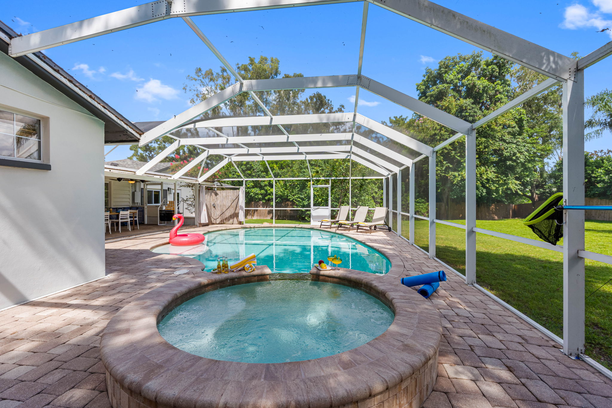Tropical outdoor escape with heated pool and soothing spa.