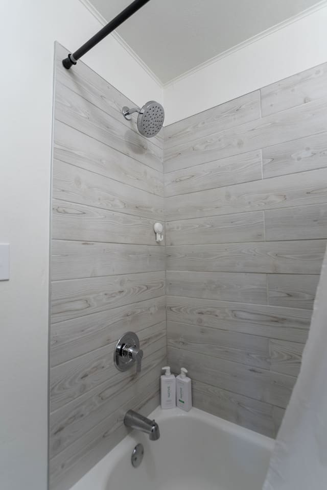 Elegant bathroom featuring both a spacious shower and a relaxing bathtub, perfect for unwinding.