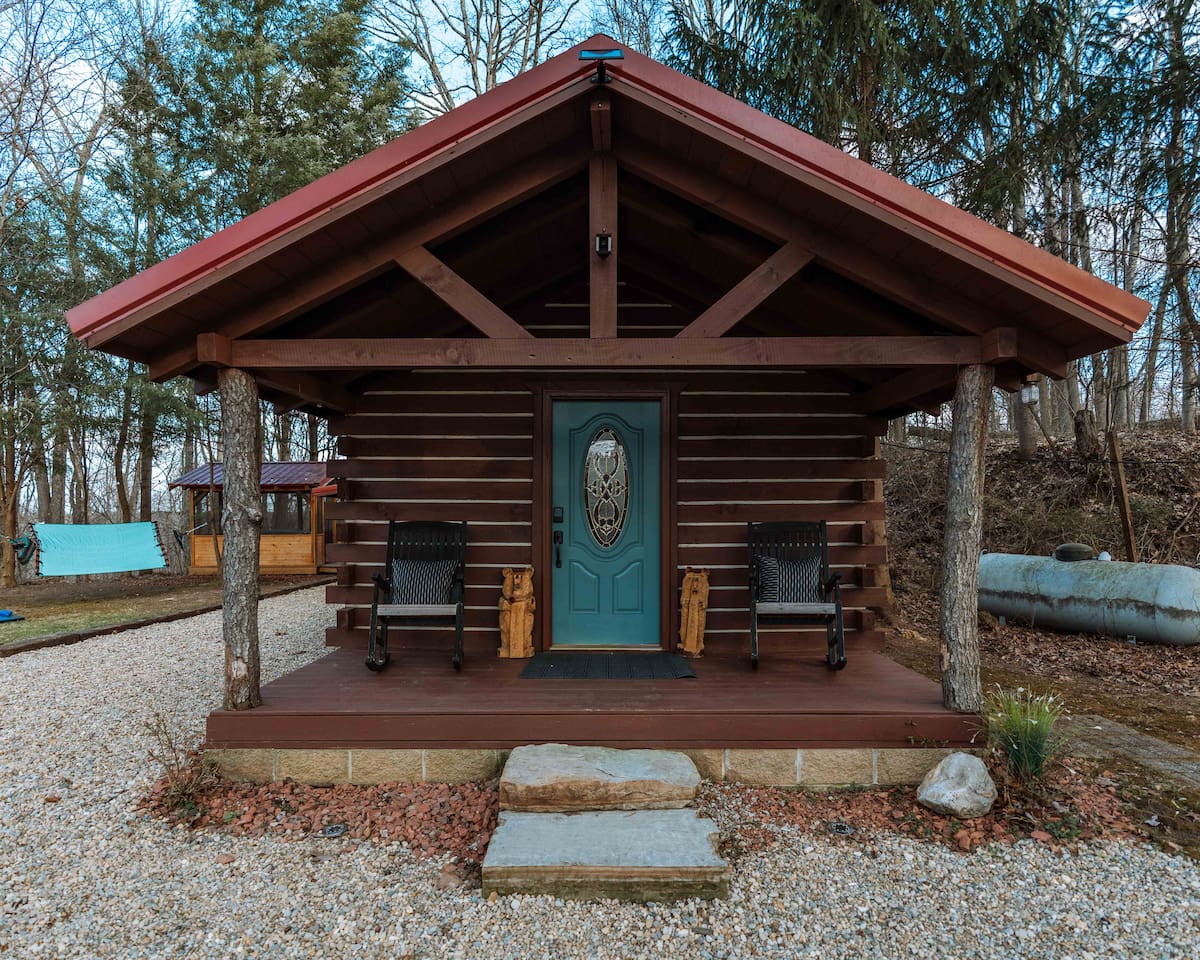 A welcoming timber-framed entry to your private hillside retreat.