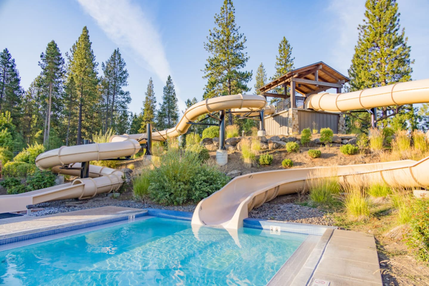 In the summer, includes a lazy river, several outdoor pools, and these two super fun big slides (42" for enclosed slide, 48" for other).