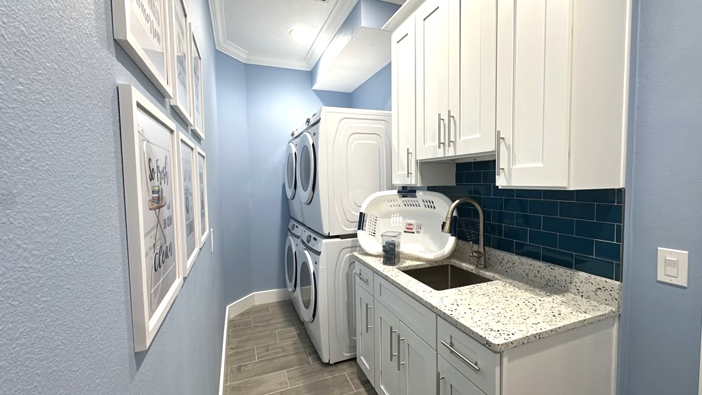 Laundry Room with Two Washers and Two Dryers