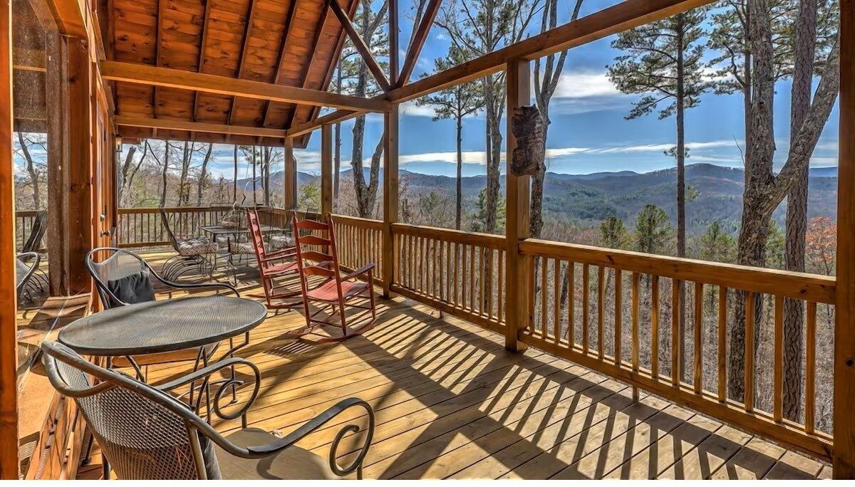 Covered deck with café seating and sweeping Blue Ridge Mountain views. Perfect for morning coffee or sunset wine.