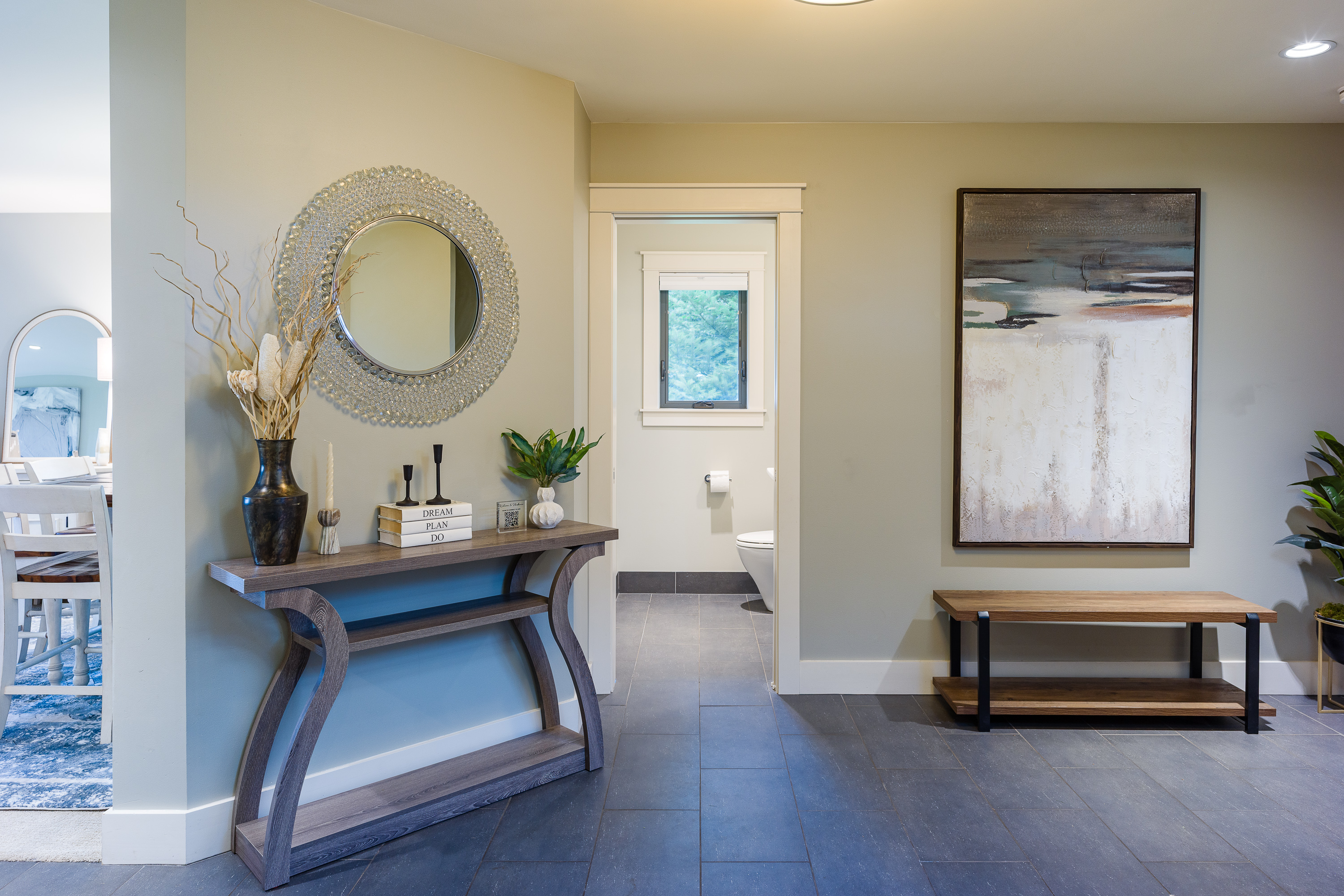 Once you enter the home you will be welcomed to a large open space with a powder room. 