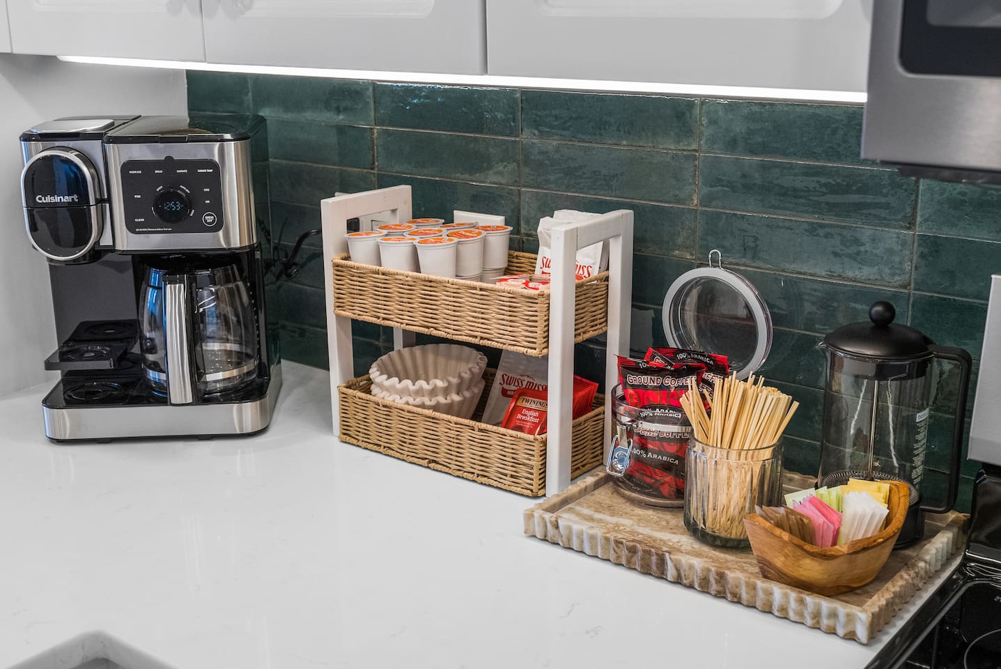 Coffee bar includes dual Cuisninart Single Serve + 12 cup carafe.  K-cups, ground coffee, tea, sugars, french press, and hot chocolate for the kids!  To-go cups also available for morning strolls on the beach.