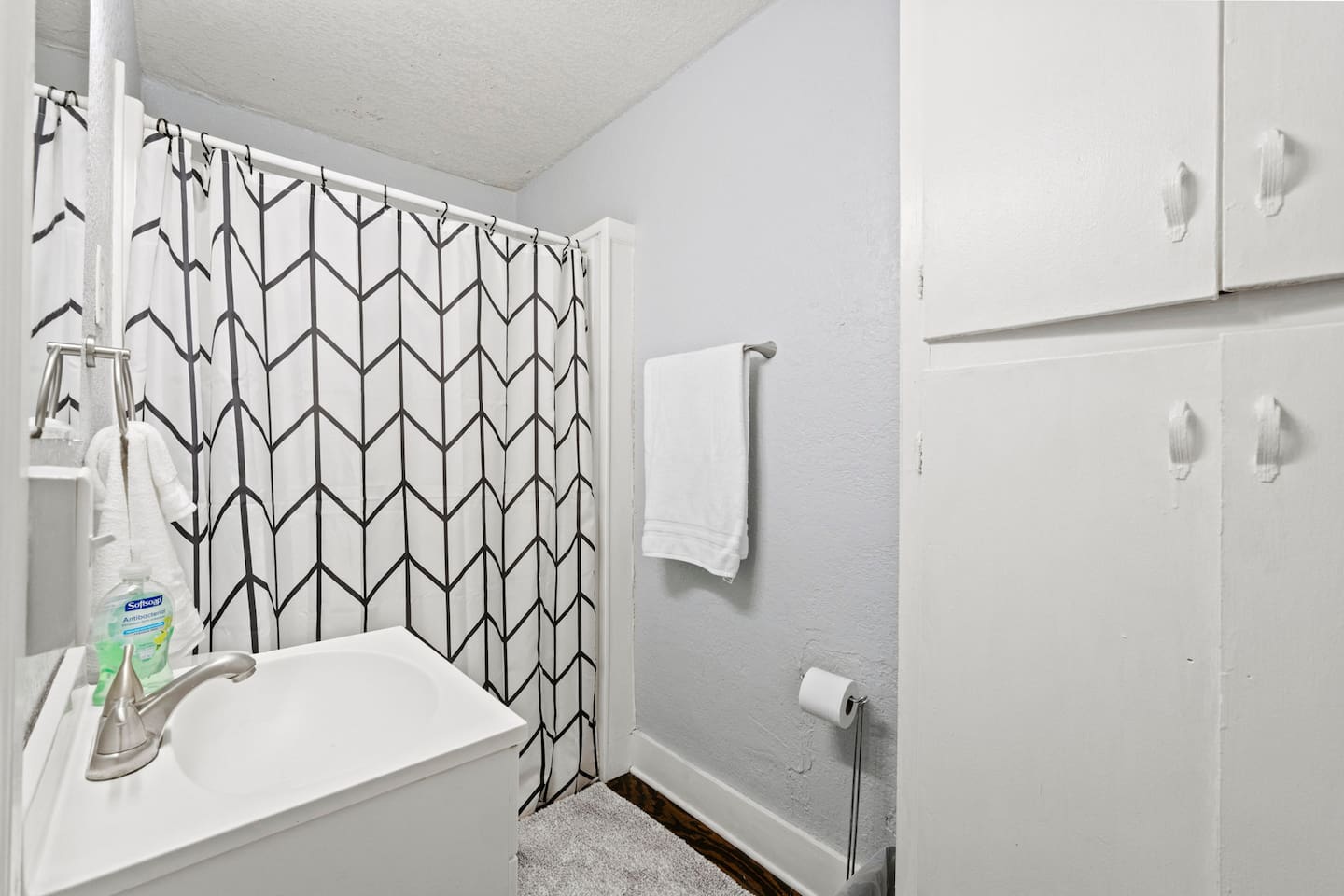 Clean and inviting bathroom stocked with fresh towels and soaps for your convenience and comfort.