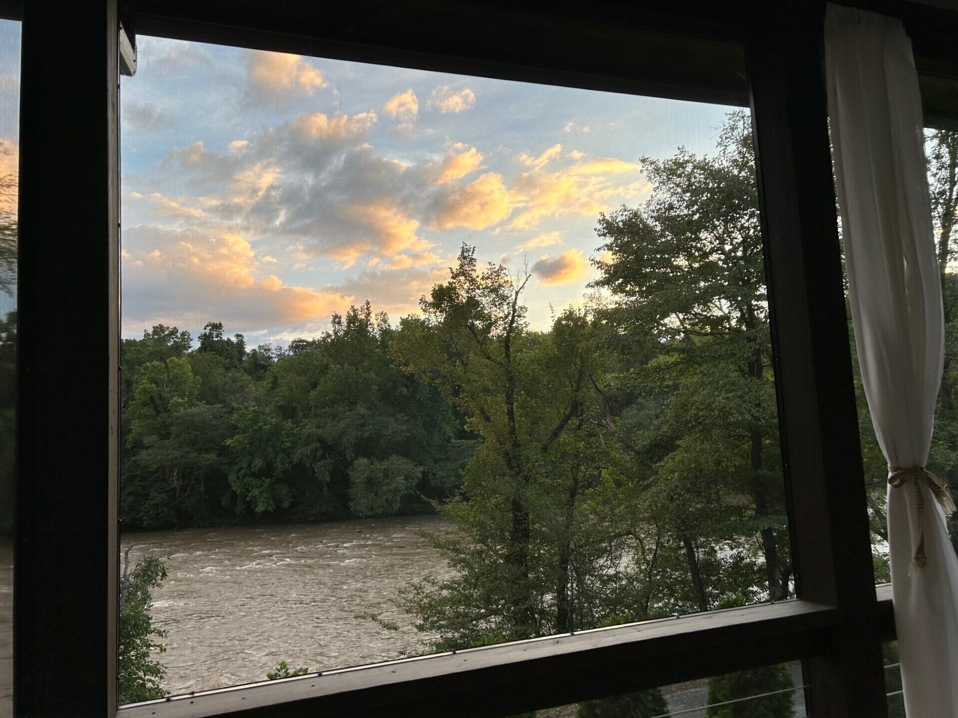 Late day changing clouds and light as seen from the dining porch