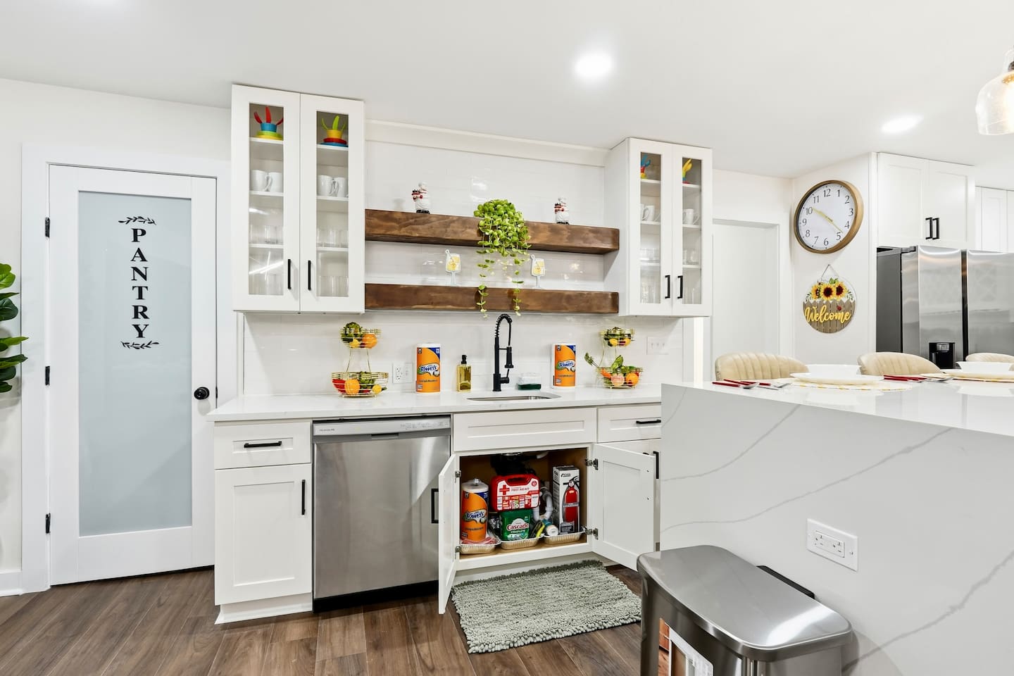 Beautiful white kitchen fully equipped with all the appliances and essentials of a home away from home.