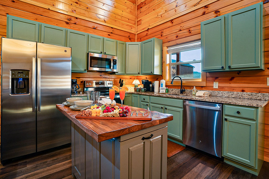 Open kitchen layout with custom made island from a local Gatlinburg craftsman.