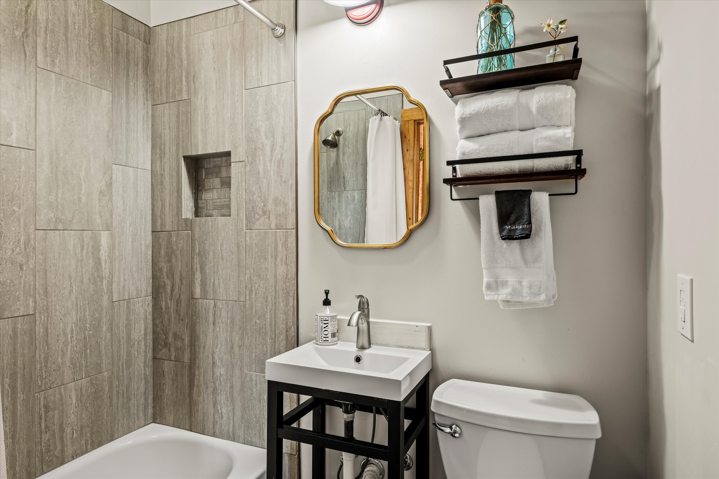 The private bathroom has a tub/shower combo.