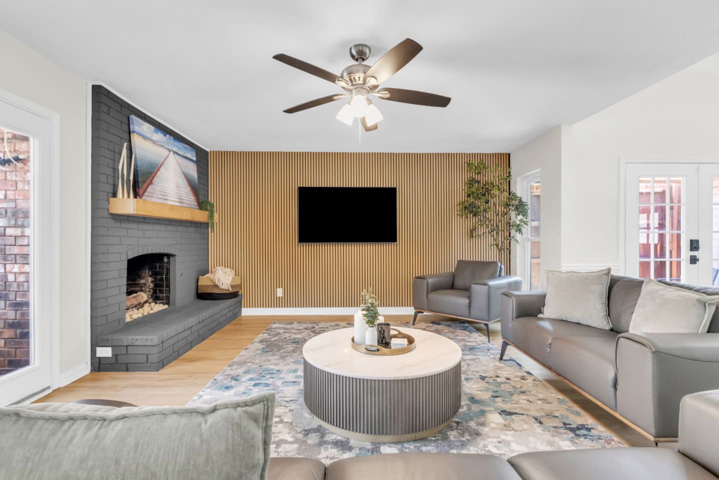 Relax in a spacious living room with ample seating and a large smart TV for movie nights