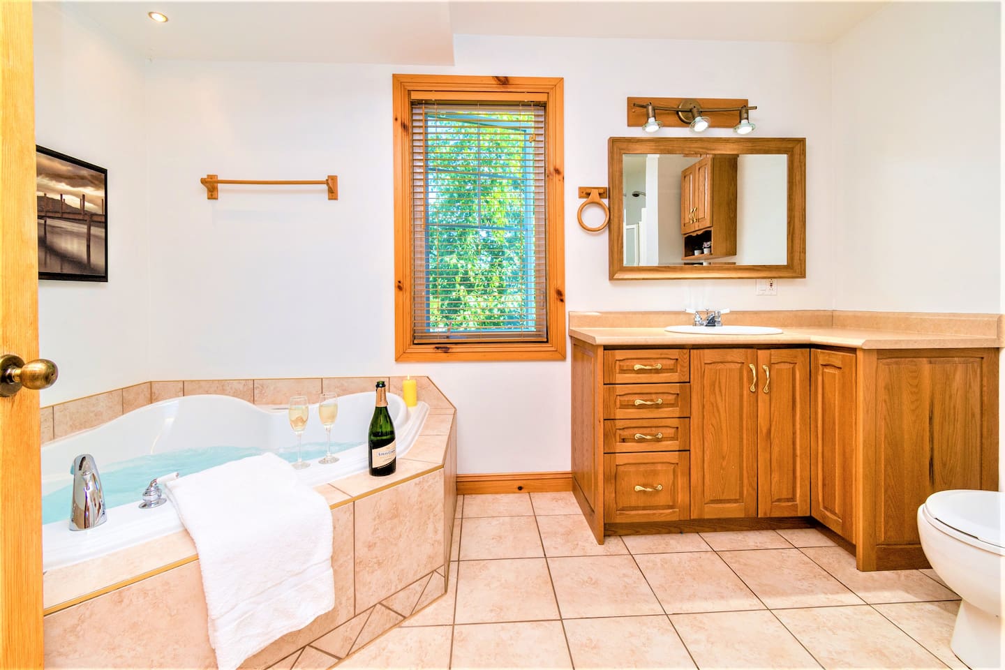 Relax in the spacious tub with everything you need nearby.