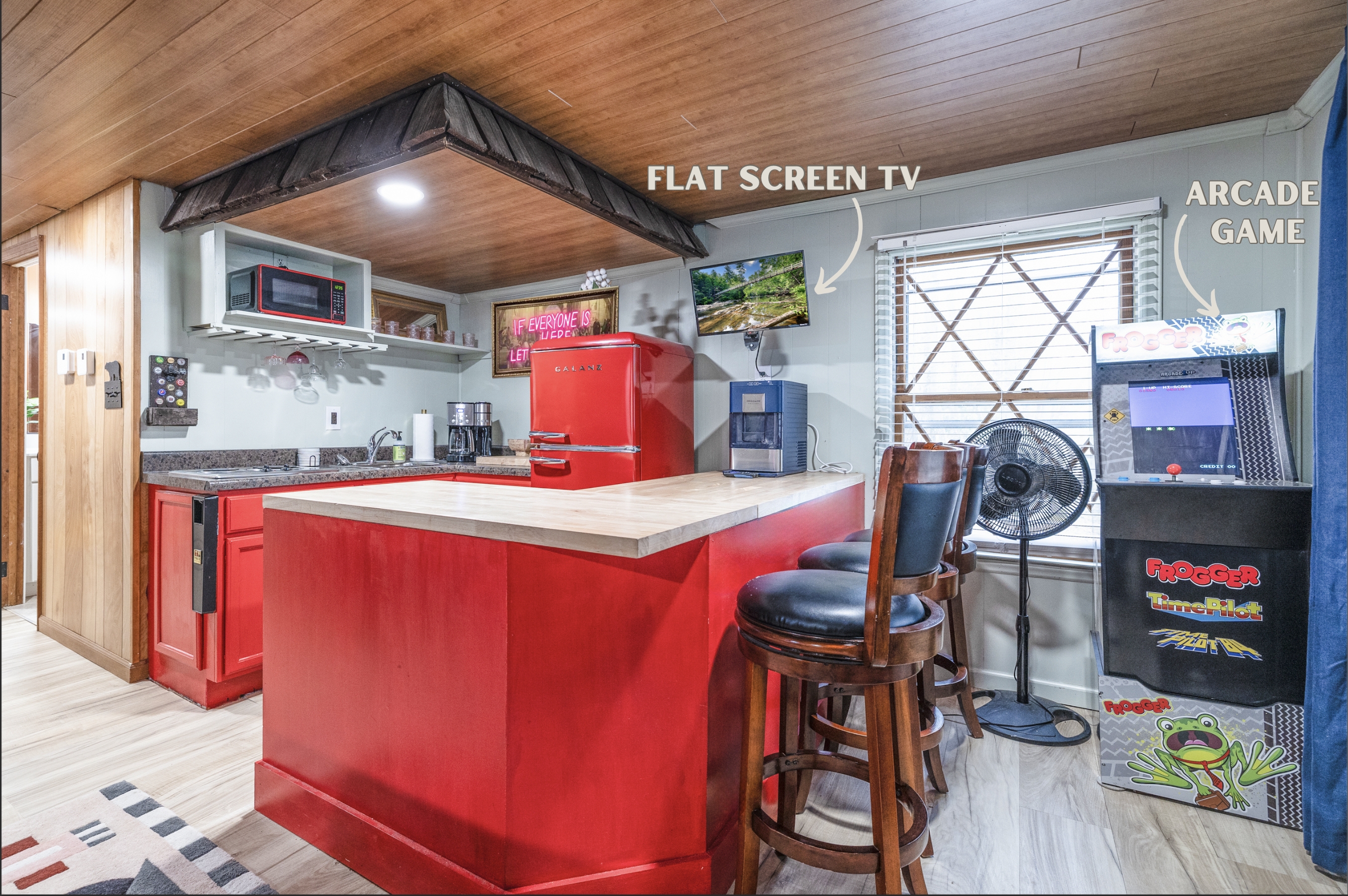 Enjoy modern comforts in our cozy kitchen featuring a flat-screen TV and a classic Frogger arcade game for nostalgic fun. 