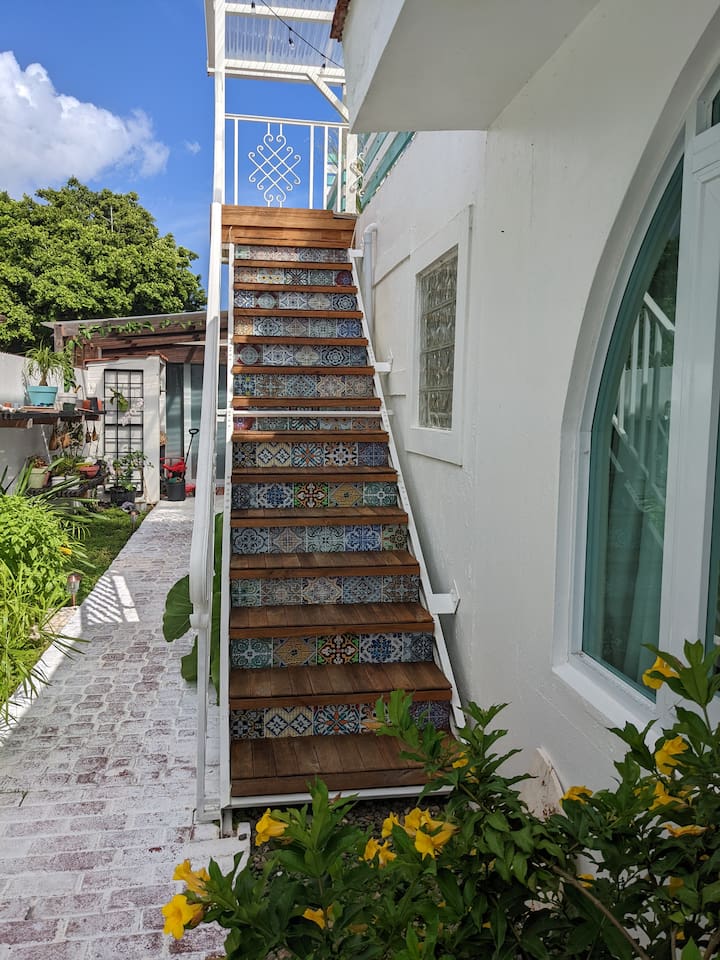 These are the stairs to go the upper level, the Coral Suite. Also a little peak down the path to our flower and herb garden. The steps are lined with 186 pieces of teak wood. Tamara was like, 'are you sure you want to do that? Thats alot of work!'. 
