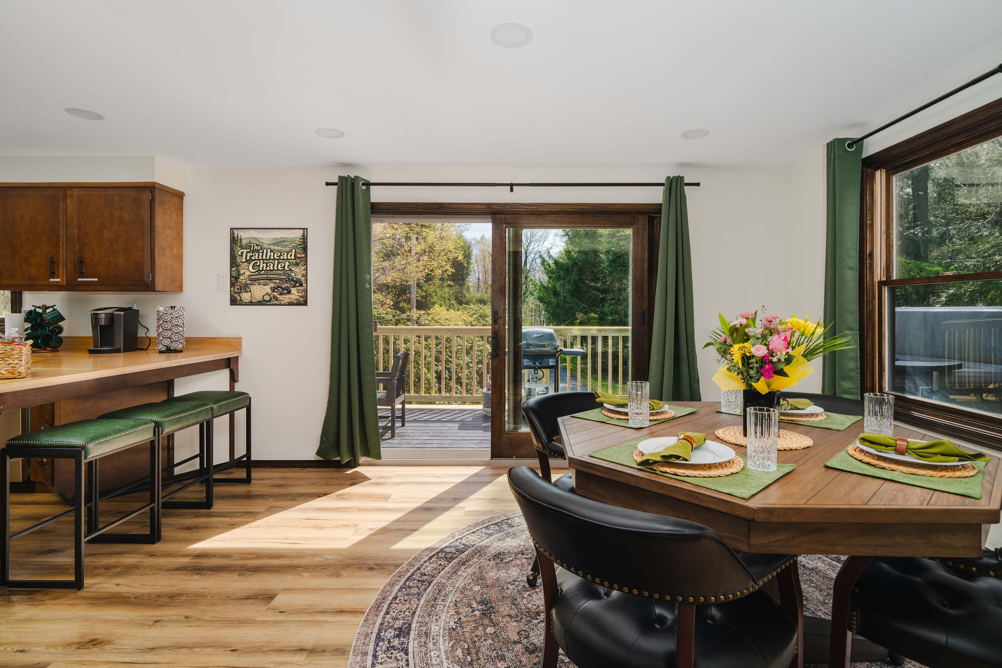 ☀️ The dining area soaks in natural light through big forest-facing windows.