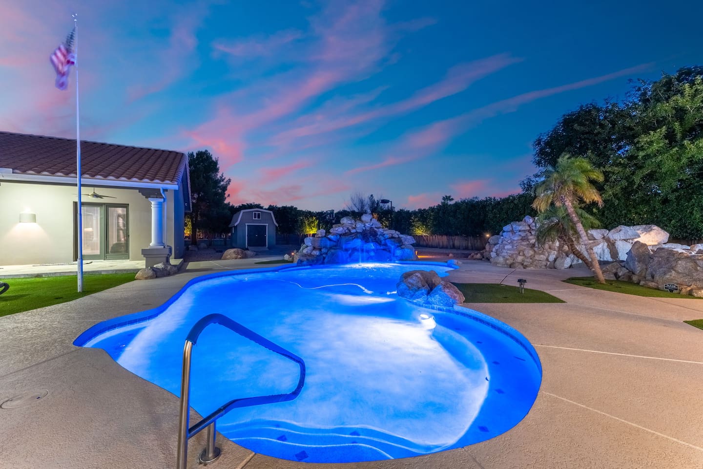 Unwind in the glow of the evening beside your very own waterfall and spa-enhanced pool.

