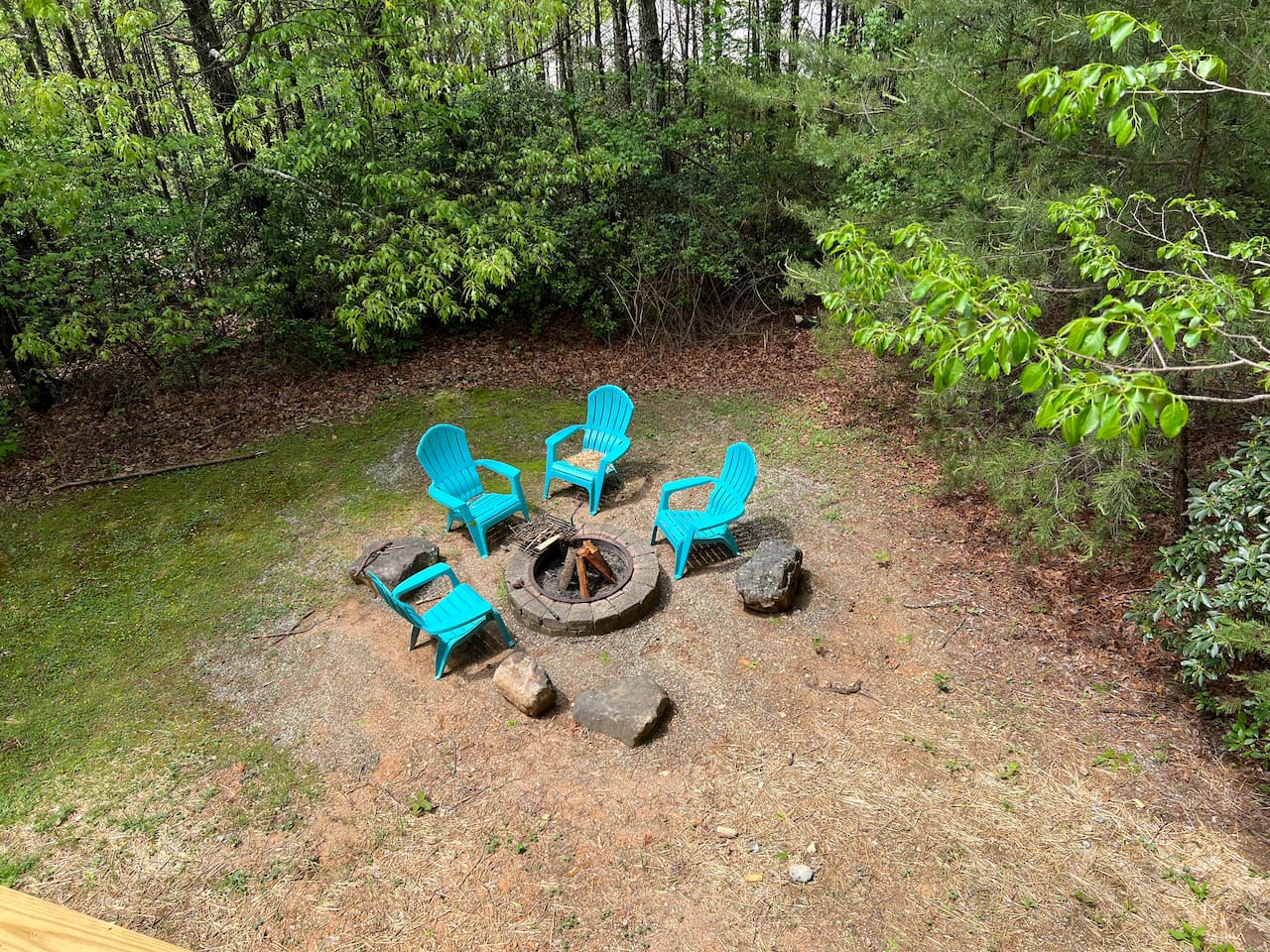 Surround by Nature, The Spacious Patio Features a Rustic Fire Pit and Seating Perfect for those Starlit Nights
