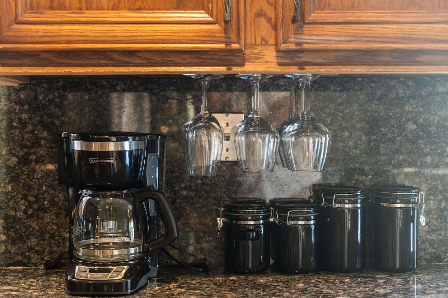 Wine glasses, a drip coffee maker, and a full canister set are all ready and waiting — the little details that make it feel like home.