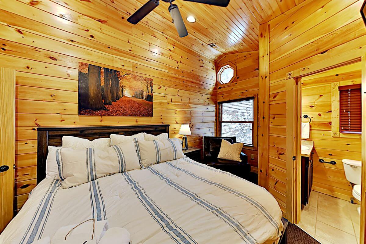 King sized bed with the larger full bathroom and small closet. TV's located in all 4 bedrooms.